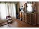 Bedroom with wood flooring, traditional style furnishings, and a large window at 5011 88Th E St, Bradenton, FL 34211