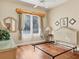 Cozy bedroom with hardwood floors, large windows, and neutral décor at 5011 88Th E St, Bradenton, FL 34211