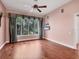 Bright bedroom with hardwood floors, large window overlooking the greenery and neutral paint at 5011 88Th E St, Bradenton, FL 34211
