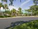 Exterior view of community buildings surrounded by tropical landscaping and a smooth paved street at 5011 88Th E St, Bradenton, FL 34211