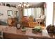 View of dining and living room with natural light and warm, inviting decor at 5011 88Th E St, Bradenton, FL 34211