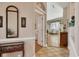 Warm entryway with tiled floors that leads to the bright and airy living room at 5011 88Th E St, Bradenton, FL 34211