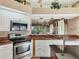 Kitchen features stainless steel appliances, and a granite-topped bar at 5011 88Th E St, Bradenton, FL 34211