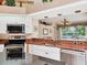 Spacious kitchen featuring stainless steel appliances, light colored cabinetry and granite counter tops at 5011 88Th E St, Bradenton, FL 34211