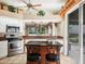 This home features a kitchen with stainless steel appliances, and a granite-topped bar at 5011 88Th E St, Bradenton, FL 34211