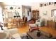 Open-concept living and dining area featuring hardwood floors and comfortable furniture at 5011 88Th E St, Bradenton, FL 34211