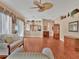 Spacious living room with hardwood floors, elegant furnishings, and ceiling fan at 5011 88Th E St, Bradenton, FL 34211