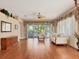 Bright living room with hardwood floors, large sliding doors, and comfortable seating at 5011 88Th E St, Bradenton, FL 34211