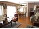 Inviting living room features hardwood floors, comfortable seating, and a dining area at 5011 88Th E St, Bradenton, FL 34211