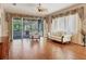 Bright living room with hardwood floors and large sliding glass doors with lots of light at 5011 88Th E St, Bradenton, FL 34211