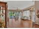 Spacious living room with hardwood floors, large sliding doors, and comfortable seating at 5011 88Th E St, Bradenton, FL 34211