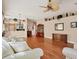 Inviting living room showcasing hardwood floors and a view into the kitchen at 5011 88Th E St, Bradenton, FL 34211