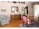 Cozy living room with hardwood floors, plush armchairs, a buffet cabinet, and decor at 5011 88Th E St, Bradenton, FL 34211