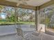 Screened patio with ceiling fan and outdoor view is ideal for relaxation and entertaining at 5011 88Th E St, Bradenton, FL 34211