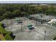 Aerial shot of tennis courts featuring well-maintained courts and green surroundings at 5011 88Th E St, Bradenton, FL 34211