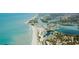Gorgeous aerial view showcasing the beach, community, and ocean waters at 530 Foxglove Rd, Venice, FL 34293
