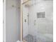 Luxurious bathroom features a glass-enclosed walk-in shower with black and white stone floor at 530 Foxglove Rd, Venice, FL 34293