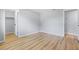 The bright bedroom features hardwood floors, fresh paint, a closet, and modern lighting at 530 Foxglove Rd, Venice, FL 34293