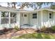 Inviting front entrance with brick walkway, manicured landscaping, and stylish front door at 530 Foxglove Rd, Venice, FL 34293
