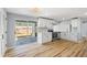 Bright kitchen featuring white cabinetry, stainless steel appliances, and a sliding door to the outdoor patio at 530 Foxglove Rd, Venice, FL 34293