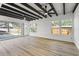 Bright sunroom with a beamed ceiling, ceiling fans, and plenty of windows at 530 Foxglove Rd, Venice, FL 34293