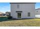 Backyard with a sliding glass door for easy indoor and outdoor living at 14853 Crescent Rock Dr, Wimauma, FL 33598
