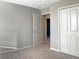 Neutral bedroom with a closet, ensuite bath, carpet flooring, and bright neutral paint at 14853 Crescent Rock Dr, Wimauma, FL 33598