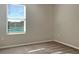 Bright bedroom features neutral paint, plush carpet, and a large window at 14853 Crescent Rock Dr, Wimauma, FL 33598