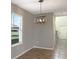 Dining area features a modern light fixture and a window with natural light at 14853 Crescent Rock Dr, Wimauma, FL 33598