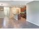 Open kitchen and living space with modern appliances, an island, and neutral decor at 14853 Crescent Rock Dr, Wimauma, FL 33598