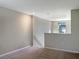 Open loft area boasts recessed lighting, plush carpet, and a scenic window view at 14853 Crescent Rock Dr, Wimauma, FL 33598