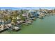 Picturesque waterfront homes boasting private docks along the serene waters, blending luxury and tranquility at 318 182Nd E Ave, Redington Shores, FL 33708