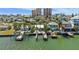Waterfront homes featuring private docks and lush palm trees, providing picturesque coastal living at 318 182Nd E Ave, Redington Shores, FL 33708