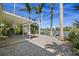 Spacious backyard featuring a covered patio and waterfront access at 318 182Nd E Ave, Redington Shores, FL 33708