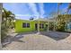 Charming home with a covered patio, tropical landscaping and sunny curb appeal at 318 182Nd E Ave, Redington Shores, FL 33708