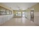 Spacious living room with large windows offering scenic waterfront views at 318 182Nd E Ave, Redington Shores, FL 33708