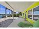 Relaxing covered patio with waterfront view and tropical landscaping at 318 182Nd E Ave, Redington Shores, FL 33708