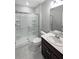 Modern bathroom with glass enclosed shower, toilet and vanity with sink at 36880 Precita Ter, Zephyrhills, FL 33542