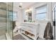 Bright bathroom featuring a glass shower, dual vanity, and stylish fixtures at 546 15Th Ne Ave, St Petersburg, FL 33704