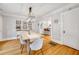 Elegant dining room with stylish lighting, artwork, and seamless flow into the kitchen at 546 15Th Ne Ave, St Petersburg, FL 33704