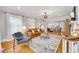 Bright living room featuring hardwood floors, modern furnishings, and seamless flow into the dining room at 546 15Th Ne Ave, St Petersburg, FL 33704