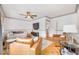 Cozy living room showcasing a sectional sofa, mounted TV, and stylish accent chairs at 546 15Th Ne Ave, St Petersburg, FL 33704