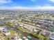 Scenic aerial shot showcasing a waterfront property with canal access, nestled in a charming residential neighborhood at 511 Sharon Cir, Port Charlotte, FL 33952