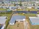 Aerial view of the waterfront home and neighborhood at 511 Sharon Cir, Port Charlotte, FL 33952