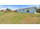 Spacious backyard with a wooden fence, providing privacy and room for outdoor activities and landscaping at 511 Sharon Cir, Port Charlotte, FL 33952