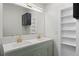 Bathroom showcasing a double sink vanity, designer fixtures, and integrated storage for a spa-like experience at 511 Sharon Cir, Port Charlotte, FL 33952
