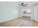 Bright bedroom with wood-look floors, light walls, and natural light at 511 Sharon Cir, Port Charlotte, FL 33952