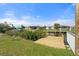 New dock with water views, lush landscaping and neighborhood houses in view at 511 Sharon Cir, Port Charlotte, FL 33952