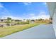 Concrete patio with manicured lawn and access to the canal at 511 Sharon Cir, Port Charlotte, FL 33952