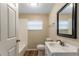 Bathroom with white vanity, mirror, and tub and shower combo at 2634 E 38Th Ave, Tampa, FL 33610
